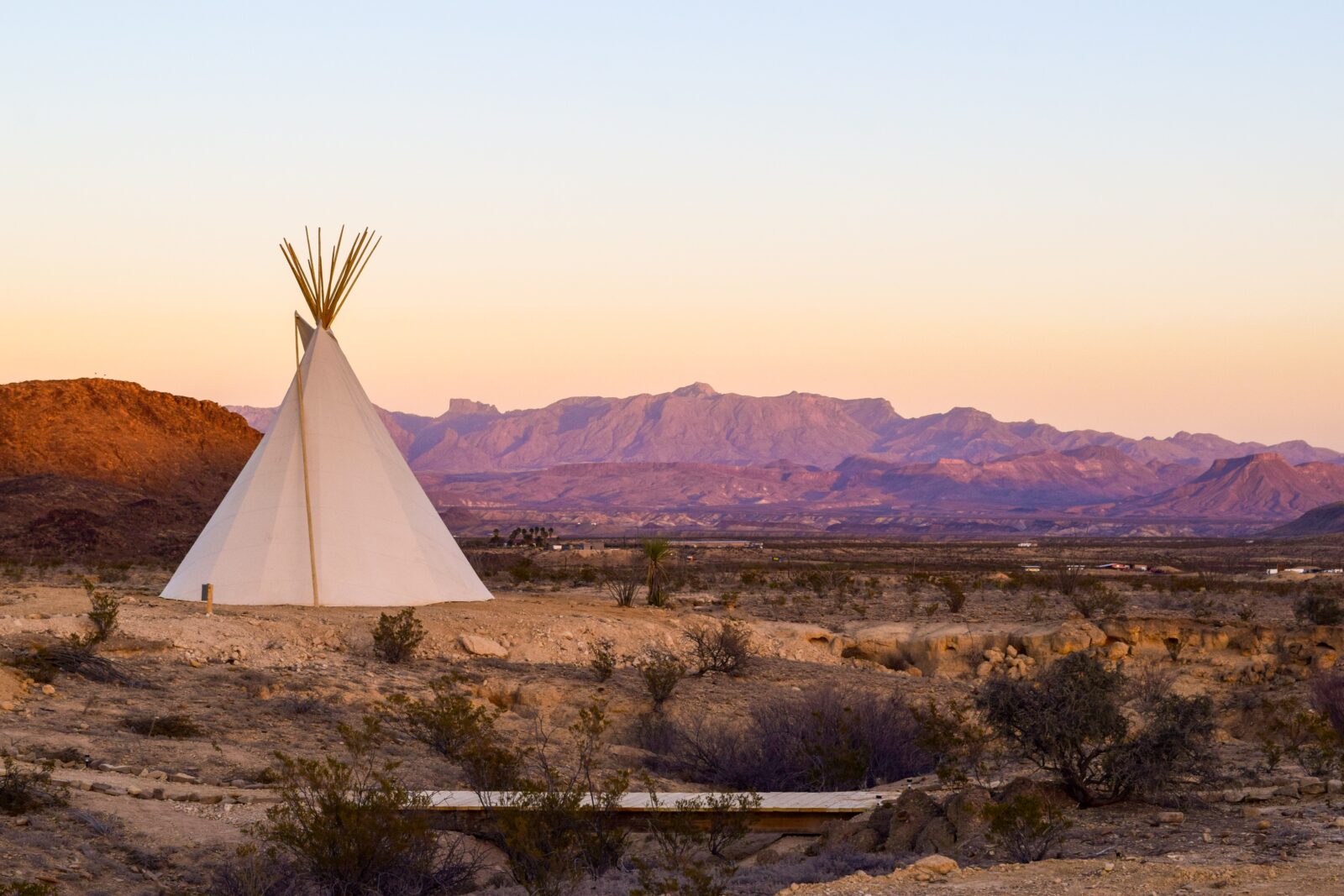 White teepee with mountains background